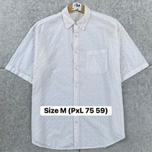 Kemeja GU Motif Bolong