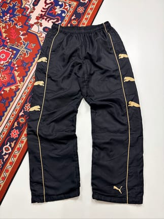 Puma black & gold multi-logo trackpants