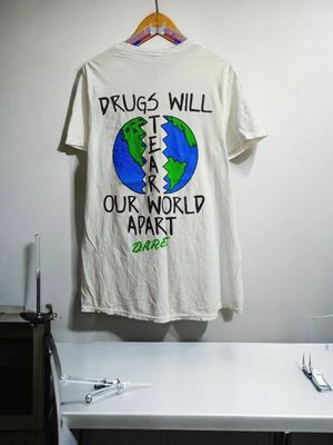 D.A.R.E KEEPING KIDS OFF DR*G
"DR*GS WILL TEAR OUR WORLD APA