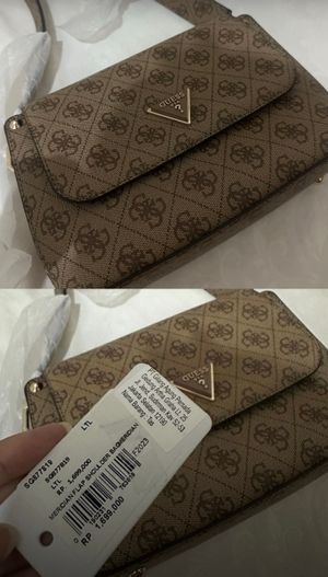 GUESS Meridian Flap Shoulder Bag is a structured handbag fea