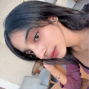 Nitya K